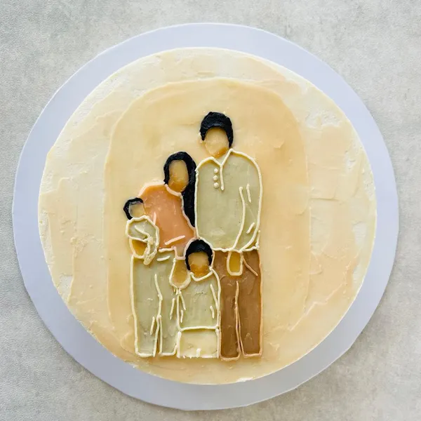 A painted family scene on a cake